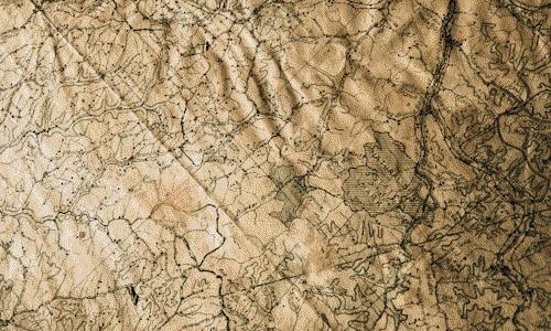 An old map on a weathered table